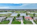 Community overview featuring houses, golf course, and a lake at 3723 Tripoli Blvd, Punta Gorda, FL 33950