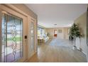 Bright and spacious entryway with stained glass door and hardwood floors at 3723 Tripoli Blvd, Punta Gorda, FL 33950