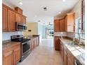 Spacious kitchen with granite countertops and stainless steel appliances at 81 Michigan Ave, Englewood, FL 34223