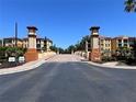 Gated community entrance with attractive landscaping and architectural details at 99 Vivante Blvd # 415, Punta Gorda, FL 33950