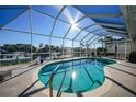 Relaxing pool and patio area with canal views at 1023 San Mateo Dr, Punta Gorda, FL 33950