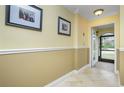 Bright entryway with two-toned walls and tiled floors at 109 Peckham Se St, Port Charlotte, FL 33952