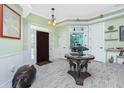 Bright entryway with a unique table and décor at 13204 Kakapo Ave, Port Charlotte, FL 33981