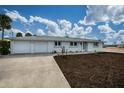 Newly renovated home with two-car garage and landscaped yard at 1350 Aqua View Ln, Englewood, FL 34223