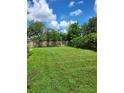 Expansive grassy backyard, perfect for outdoor activities at 158 Concord Ne Dr, Port Charlotte, FL 33952