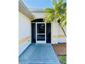 Screened front porch entryway with a view of the interior at 2057 Wonderwin St, Port Charlotte, FL 33948