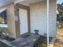 Front entrance with brick exterior and small porch at 21921 Beverly Ave, Port Charlotte, FL 33952