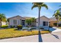 One-story home with a two-car garage and well-manicured lawn at 24060 Buckingham Way, Punta Gorda, FL 33980