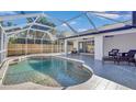 Inviting screened pool and patio area, perfect for relaxation at 2418 Frantz St, North Port, FL 34286