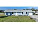 Newly renovated light blue home with a spacious yard at 282 Seminole Nw Blvd, Port Charlotte, FL 33952