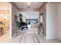 Spacious entryway with view of living room and piano at 2856 Deborah Dr, Punta Gorda, FL 33950