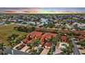 Aerial view of condo community at sunset, showing building and location at 3500 Mondovi Ct # 212, Punta Gorda, FL 33950