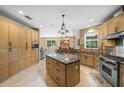 Spacious kitchen featuring an island and ample cabinetry at 5208 Griggs Ave, North Port, FL 34291