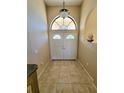 Bright entryway with double doors and tile flooring at 699 Monaco Dr, Punta Gorda, FL 33950