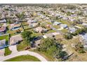 Aerial view showing home's location in a residential neighborhood at 701 Coral Way, Englewood, FL 34223