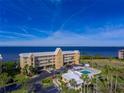 Building and community pool with water view at 101 N. Marion Court # 222, Punta Gorda, FL 33950