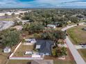 Aerial view showing house, yard, and pool at 1236 Fleetwood Nw Dr, Port Charlotte, FL 33948