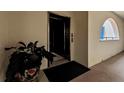 Building hallway with elevator access and potted plant at 1340 Rock Dove Ct # 135, Punta Gorda, FL 33950