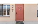 Condo front door entrance with a welcome mat at 1348 Rock Dove Ct # C103, Punta Gorda, FL 33950