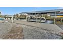 Private boat dock with covered lift and walkway at 162 Croop Se Ln, Port Charlotte, FL 33952