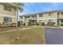 Exterior view of a light green building with parking at 25225 Rampart Blvd # 1606, Punta Gorda, FL 33983
