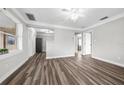 Living room featuring wood-look floors and neutral wall colors at 30087 Alder Rd, Punta Gorda, FL 33982