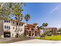 Exterior view of building, showcasing its architectural details and landscaping at 3308 Purple Martin Dr # 135, Punta Gorda, FL 33950