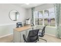 Home office with built-in desk and ample natural light at 3340 Jennings Blvd, Port Charlotte, FL 33981