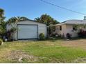 View of detached garage from the side yard at 4363 Sansedro St, Port Charlotte, FL 33948