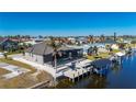 Beautiful home features a private pool, dock, and lush landscaping at 4600 Almar Dr, Punta Gorda, FL 33950