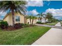 Landscaped neighborhood with similar homes and a sidewalk at 6139 Grand Cypress Blvd, North Port, FL 34287