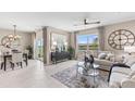 Open concept living and dining area with lots of natural light at 9578 Turtle Grass Cir, Punta Gorda, FL 33950