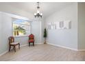 Dining area with wood-look floors and a bay window at 11346 Laffite Pl, Port Charlotte, FL 33981