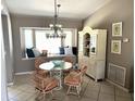 Bright dining area with a bay window and built-in hutch at 16161 Juarez Cir, Punta Gorda, FL 33955