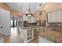 Elegant kitchen featuring granite countertops and custom cabinetry at 17557 Ohara Dr, Port Charlotte, FL 33948