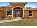 Front entrance with decorative screen door and fountain at 201 Champion St, Port Charlotte, FL 33953