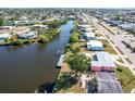 Aerial view showcasing home's canal-front location and neighborhood at 21094 Edgewater Dr, Port Charlotte, FL 33952