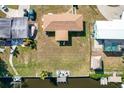 Bird's eye view of canal front property with a backyard at 21094 Edgewater Dr, Port Charlotte, FL 33952