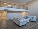 Condo common area with couches and a high ceiling at 2290 Aaron St # 302, Port Charlotte, FL 33952