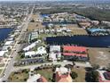 Aerial view showcasing a waterfront condo community, highlighting its location and amenities at 3216 Purple Martin Dr # 123, Punta Gorda, FL 33950