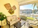 Relaxing lanai with water views and comfy seating at 3311 Wood Thrush Dr # 111, Punta Gorda, FL 33950