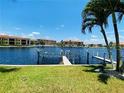 Canal front view with boat docks and lush landscaping at 3311 Wood Thrush Dr # 111, Punta Gorda, FL 33950