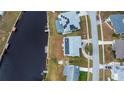 Home sits on a canal lot with solar panels at 6365 Scorpio Ave, North Port, FL 34287