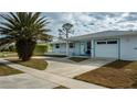 Ranch-style home with a carport and mature landscaping at 6365 Scorpio Ave, North Port, FL 34287