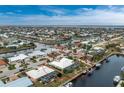 Aerial view of canal-front home with pool at 760 Bal Harbor Blvd, Punta Gorda, FL 33950