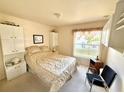 Cozy bedroom with a double bed and built-in white cabinets at 8541 Regency Ct, North Port, FL 34287