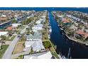 Wide aerial showcasing the home's waterfront lot and surrounding community at 88 Sabal Dr, Punta Gorda, FL 33950