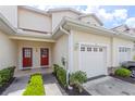 Front view of townhome with double doors and garage at 1259 Jonah Dr, North Port, FL 34289