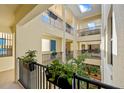 Bright condo interior hallway with skylights and lush plants at 1340 Rock Dove Ct # 134, Punta Gorda, FL 33950