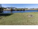 View of waterfront property with canal and distant home at 143 Rotonda Cir, Rotonda West, FL 33947